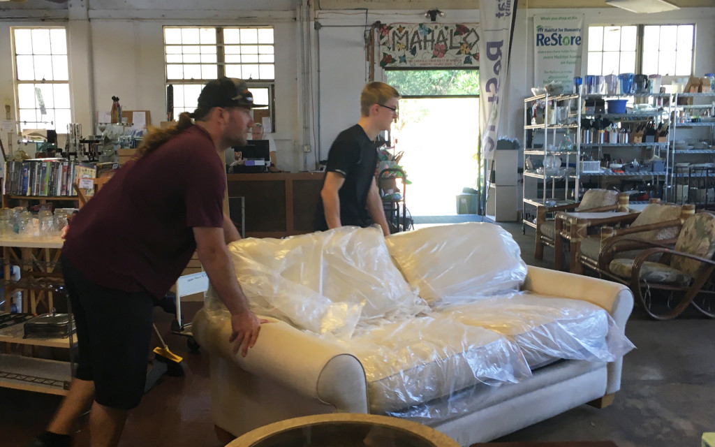 volunteer Julius Krah with staff Kris Bush moving furniture donations 031816